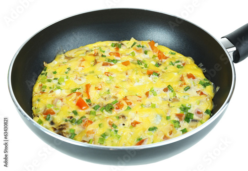 Omelet with vegetables close up