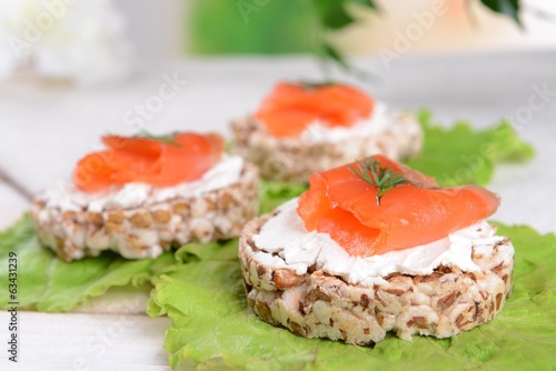 Delicious canapes on table close-up