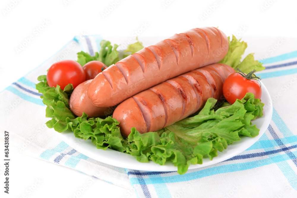 Grilled sausage on plate on table close-up Grilled sausage on plate on table close-up