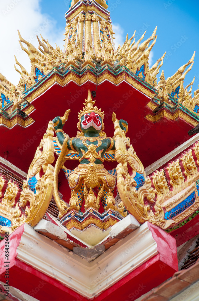 Garuda statue on top of traditional Thai style church Garuda statue on top of traditional Thai style church