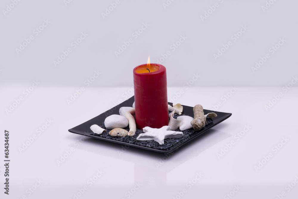 A barrel with a candle and decoration