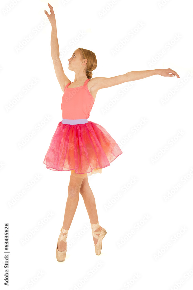 Cute young ballerina in fourth position on pointe Cute young ballerina in fourth position on pointe