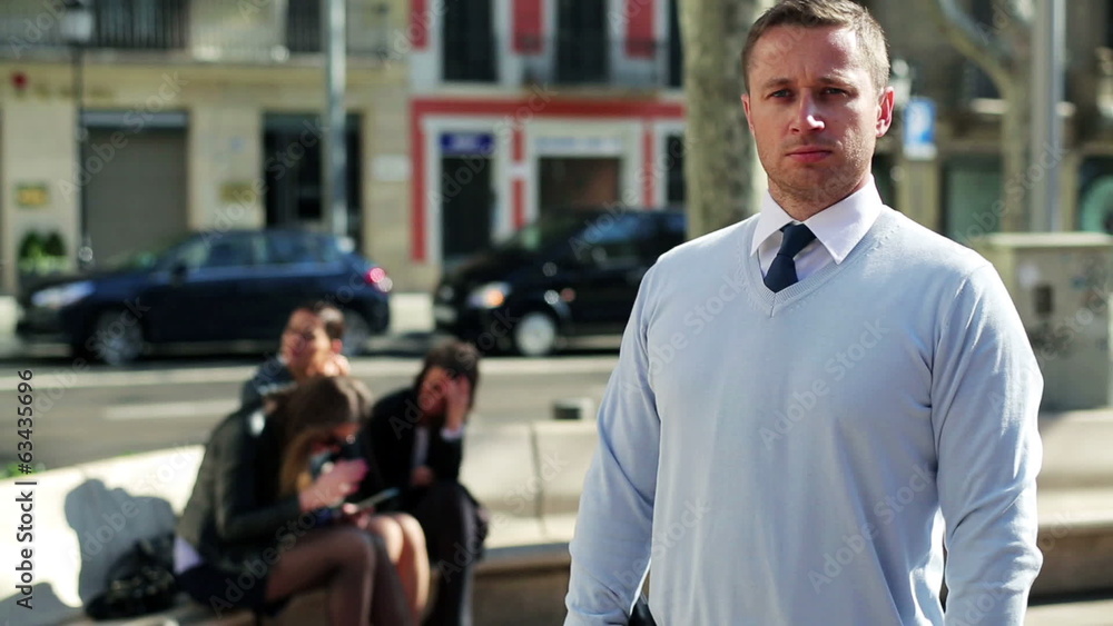Confident businessman looking to camera on the street, steadycam Confident businessman looking to camera on the street, steadycam