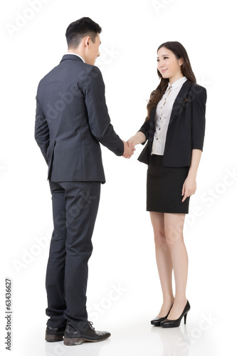 Business woman and man shake hands