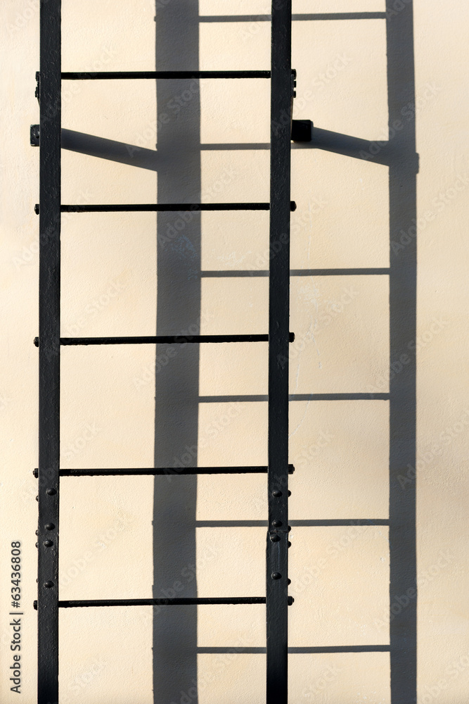 Ladder casting shadow on wall Ladder casting shadow on wall