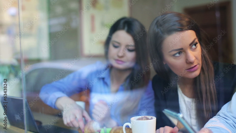 Businesspeople eating breakfast in cafe, steadycam shot Businesspeople eating breakfast in cafe, steadycam shot