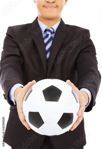 Fototapeta Naklejka Na Ścianę i Meble -  smiling businessman show a soccer