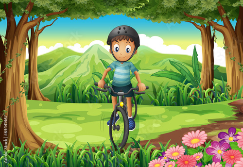 A boy biking at the jungle
