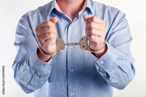 Close up of a man in handcuffs arrested