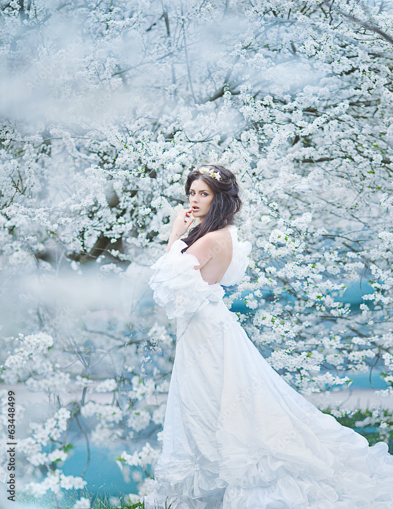 portrait of young lovely woman in spring flowers portrait of young lovely woman in spring flowers