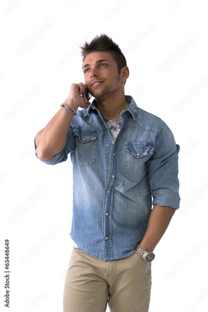 Handsome young man talking on cell phone (mobile), smiling Handsome young man talking on cell phone (mobile), smiling