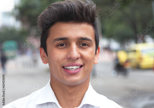 Portrait of a laughing brasilian student in the city photo
