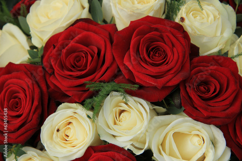 Red and white roses in a wedding arrangement