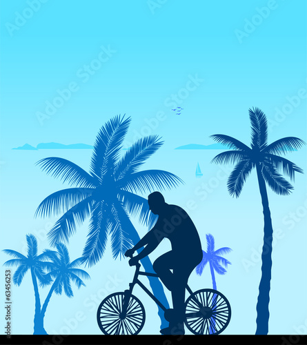 Man bike ride on the beach silhouette