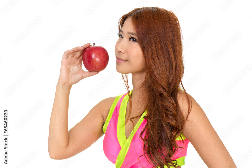 Beautiful fit Chinese woman holding an apple Beautiful fit Chinese woman holding an apple