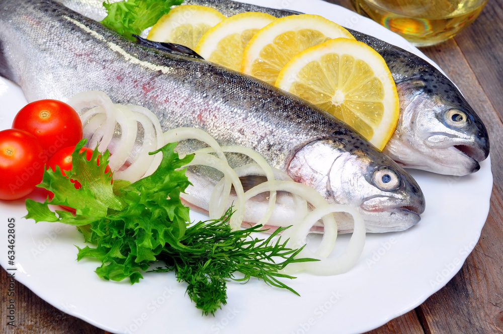 trout on a plate with vegetables trout on a plate with vegetables