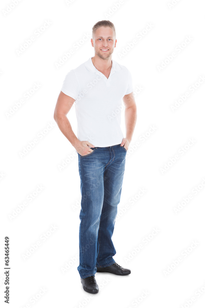 Relaxed sexy attractive young man in jeans and a white t-shirt Relaxed sexy attractive young man in jeans and a white t-shirt