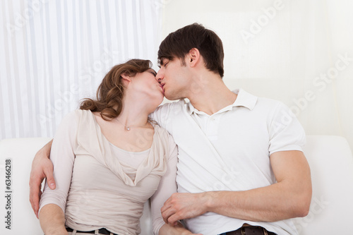 Affectionate couple relaxing on a sofa