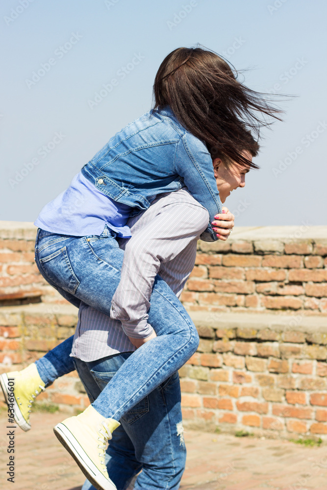 Playful young couple enjoying the spring day Playful young couple enjoying the spring day