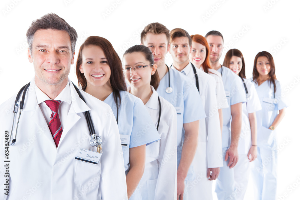 Long line of smiling doctors and nurses Long line of smiling doctors and nurses