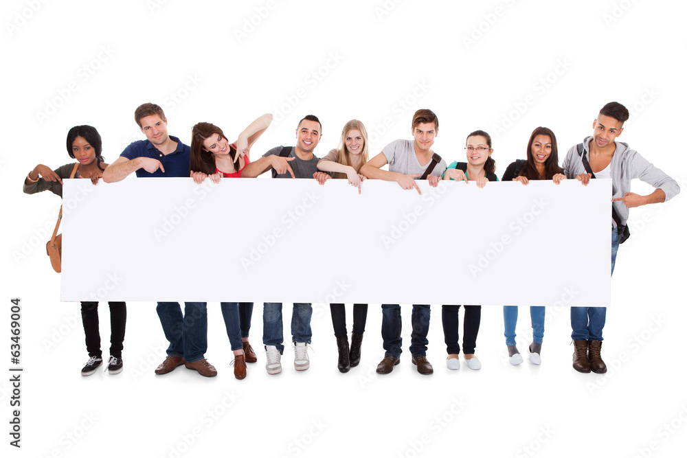 Obraz premium College Students Displaying Blank Billboard
