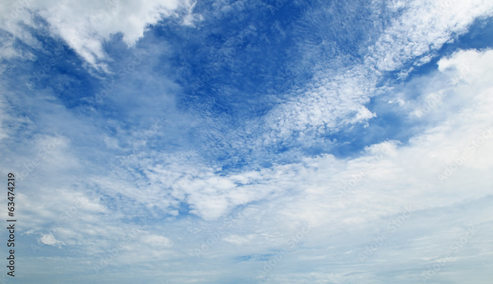 The white cumulus clouds against the blue sky The white cumulus clouds against the blue sky