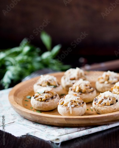 Mushroom champignons stuffed with filling of chicken, cheese