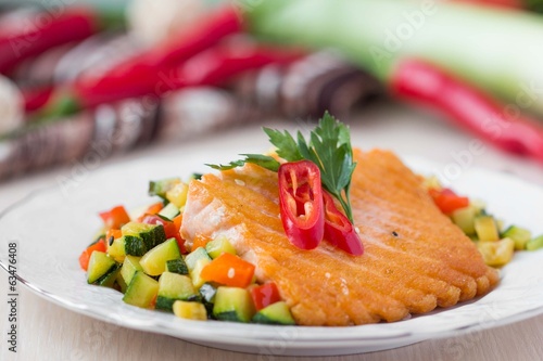 Fried fillet of red fish salmon with roasted vegetables