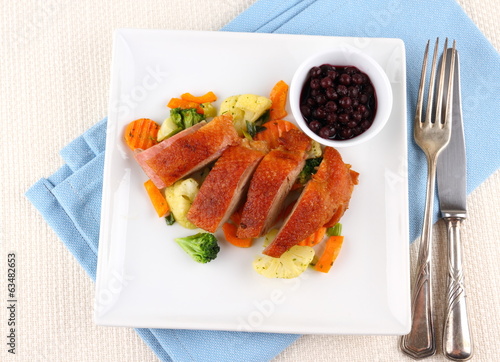 Roasted duck breast with vegetables, wild blueberries
