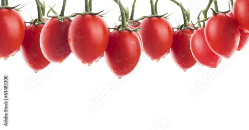 oval tomatoes with water drops, banner,isolated © VICUSCHKA