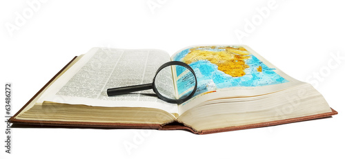 Atlas and encyclopedia with a magnifying glass