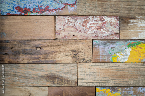 Detail of a board with old paint on it.