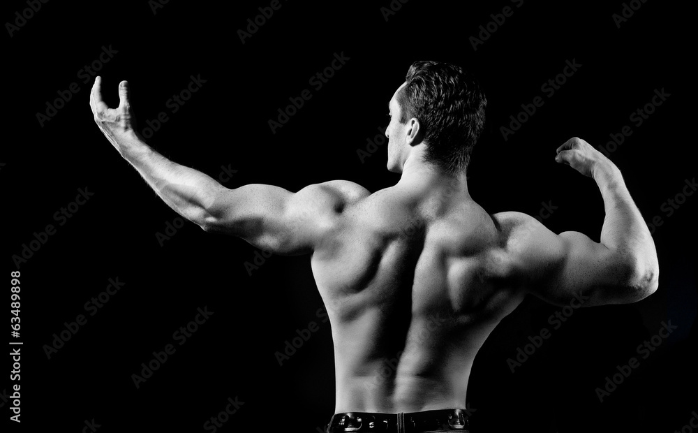 Fototapeta premium Bodybuilder showing his muscles