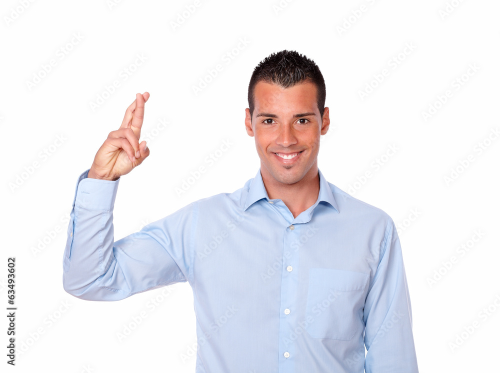 Attractive hispanic man with luck gesture Attractive hispanic man with luck gesture