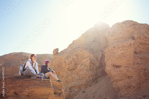 girls hiking on the rocks
