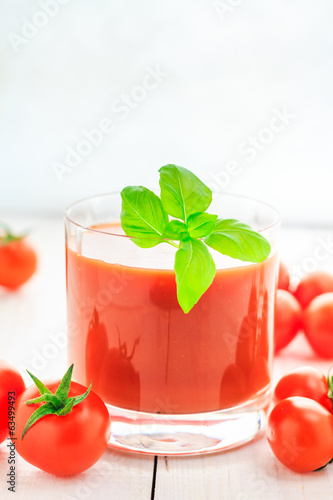 Fresh tomato juice wooden background