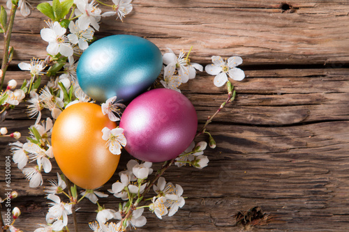Easter colored eggs on wood