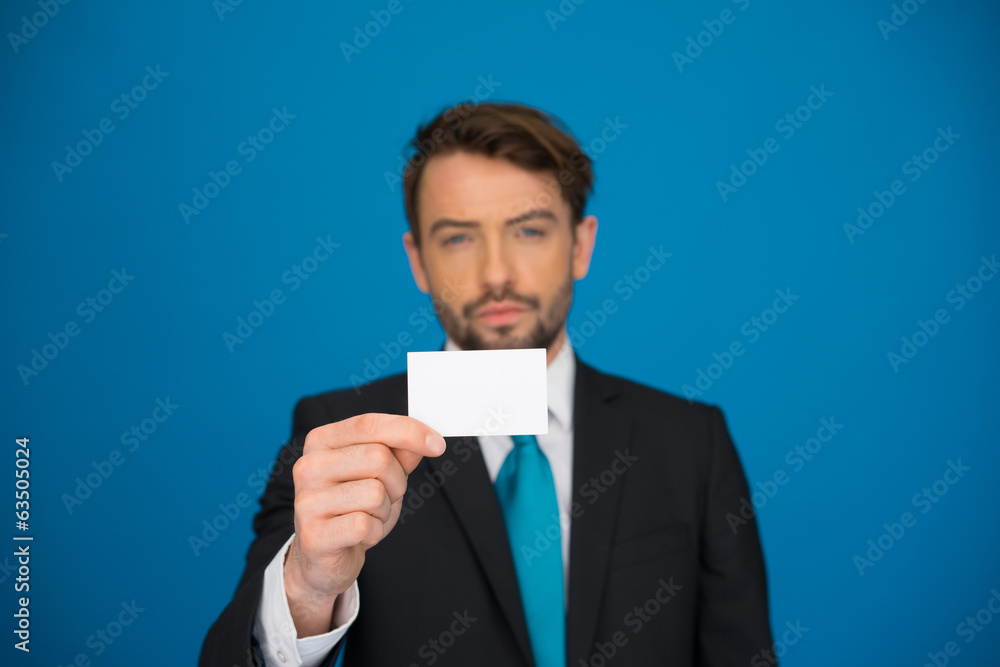 handsome businessman showing blank business card handsome businessman showing blank business card