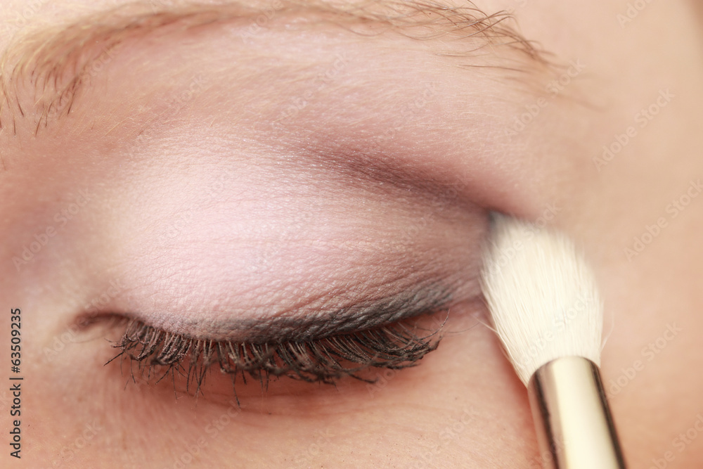 Part of face female eye makeup applying with brush