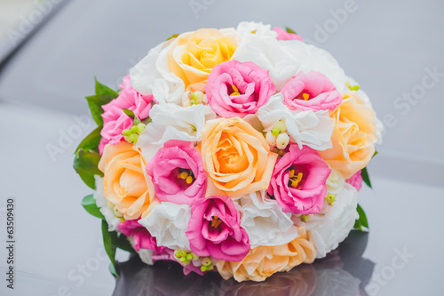 wedding bouquet in hands of the brid