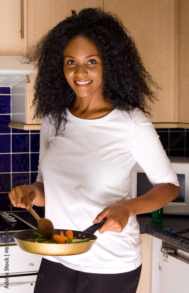 young woman cooking dinner