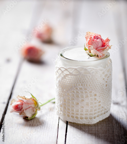 Rose flavor Greek yogurt in a glass jarwith lace photo