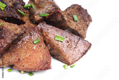 Fried pork liver with green onion isolated on white