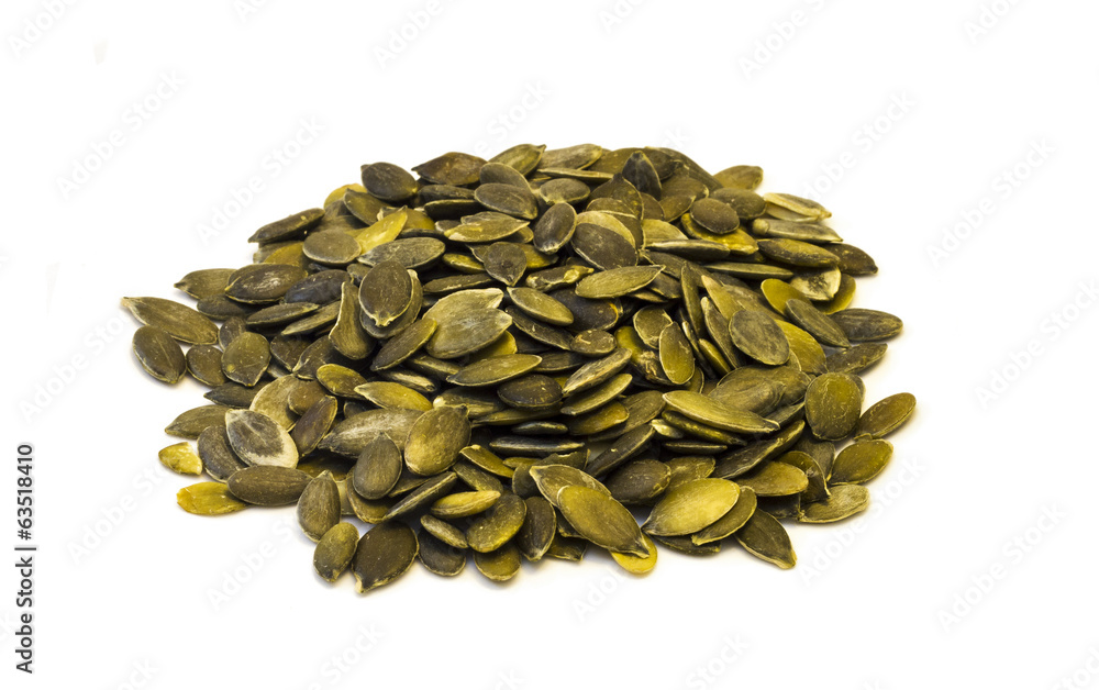 Pumpkin seeds on a white background . Pumpkin seeds on a white background .