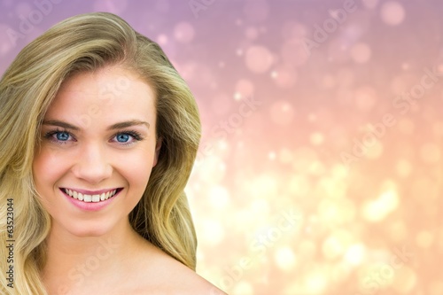 Composite image of smiling blonde natural beauty