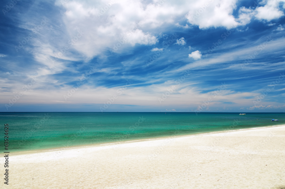 Clear water and blue sky. White sand beach Clear water and blue sky. White sand beach