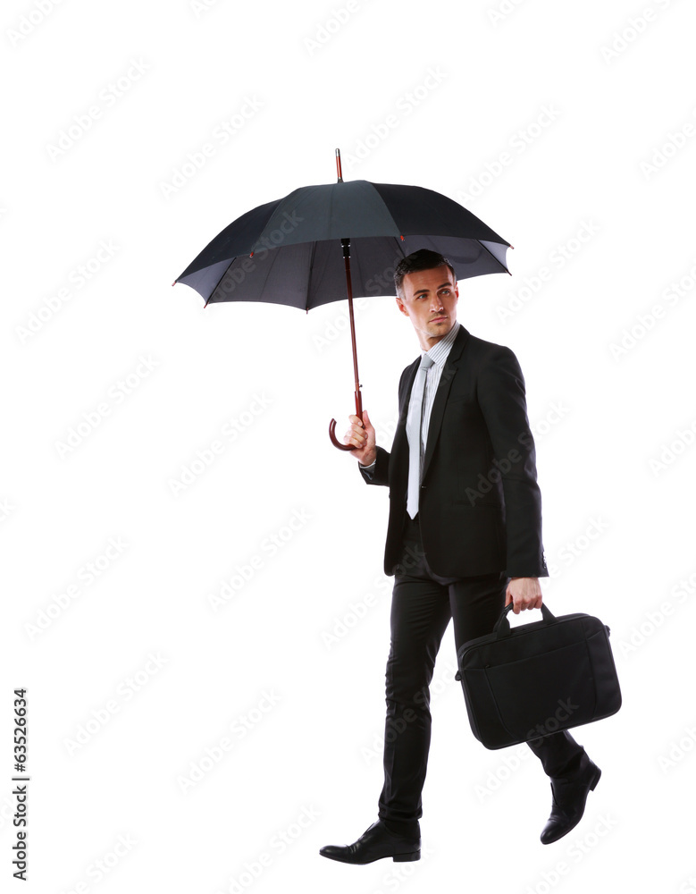 Businessman walking with umbrella and laptop bag Businessman walking with umbrella and laptop bag