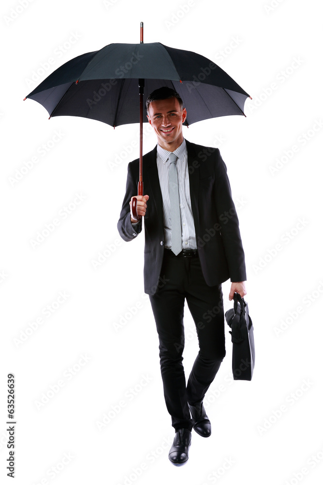Businessman walking with umbrella and laptop bag Businessman walking with umbrella and laptop bag
