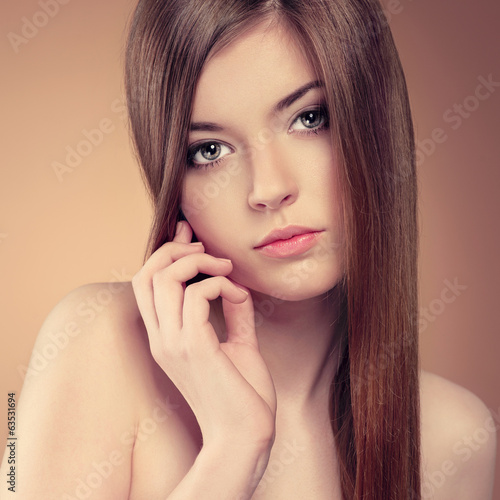 Close-up of pretty girl with beautiful healthy long hair