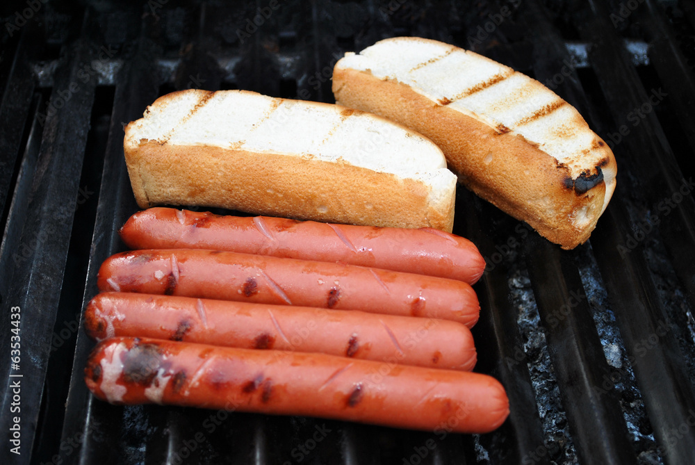 Hot Dogs and Buns on a Summer Grill Hot Dogs and Buns on a Summer Grill